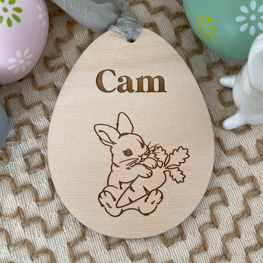 EASTER EGG SHAPED TAG WITH EASTER BUNNY HOLDING A CARROT