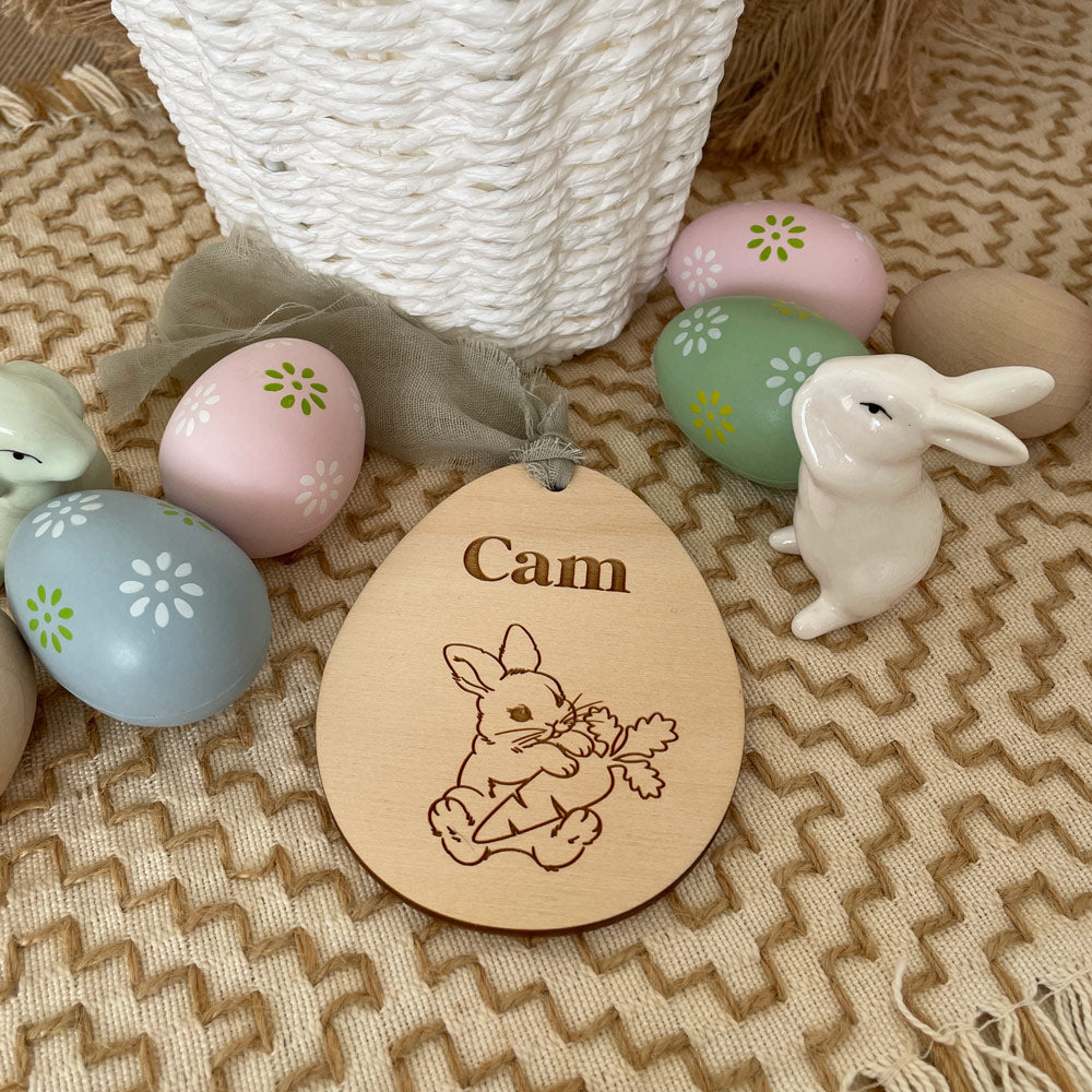 EASTER EGG SHAPED TAG WITH EASTER BUNNY HOLDING A CARROT